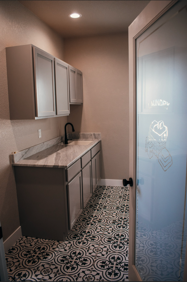 Pueblo New Construction laundry room details, unique tile and cabinets.